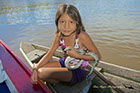 Girl with her pet anaconda, Rio Negro River Brazil